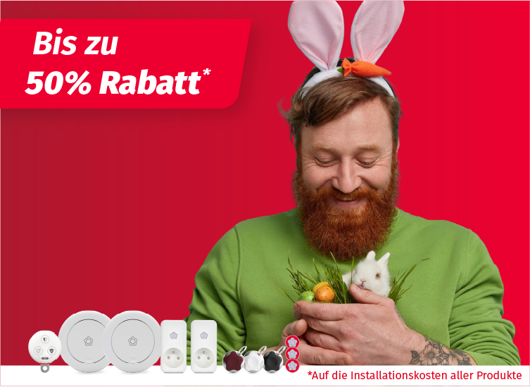 Werbebanner mit rotem Hintergrund: Zwei Personen mit Hasenohren halten Ostereier, daneben Sicherheitsprodukte von Verisure und der Text ‚Bis zu 50 % Rabatt‘